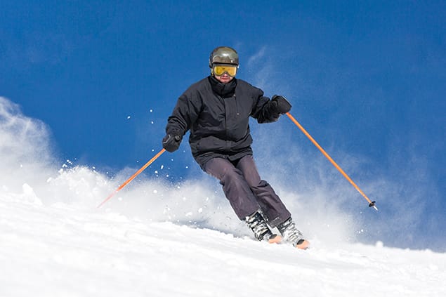 bigstock-Skier-Skiing-On-Ski-Slope-100356569