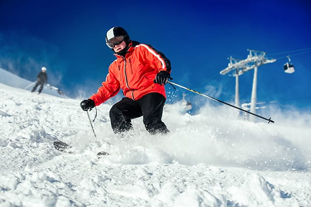 bigstock-Skier-Skiing-On-Ski-Slope-113083538